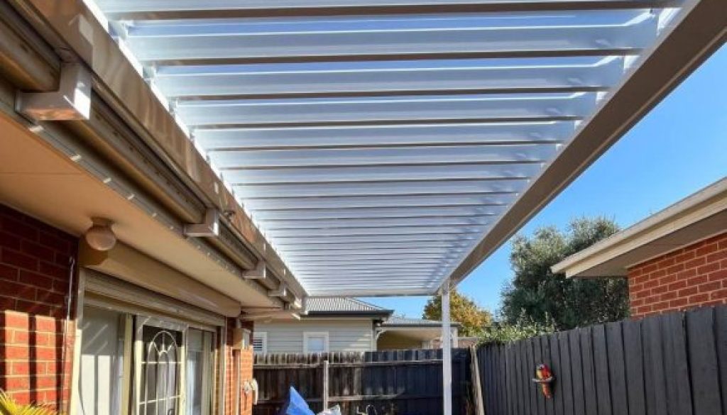 Pergola with clear roofing panels